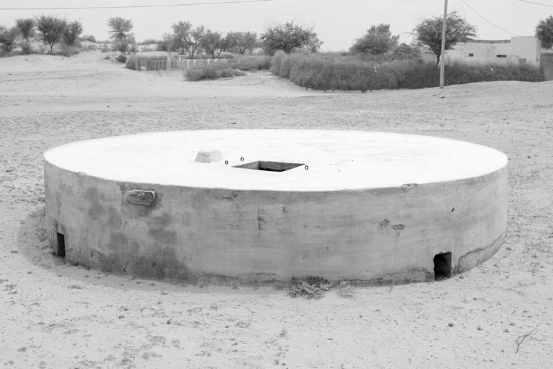 A large underground tank (kund) for storing rainwater collected from a catchment located in a communal space - village Binjharwali, Bikaner district, Rajasthan